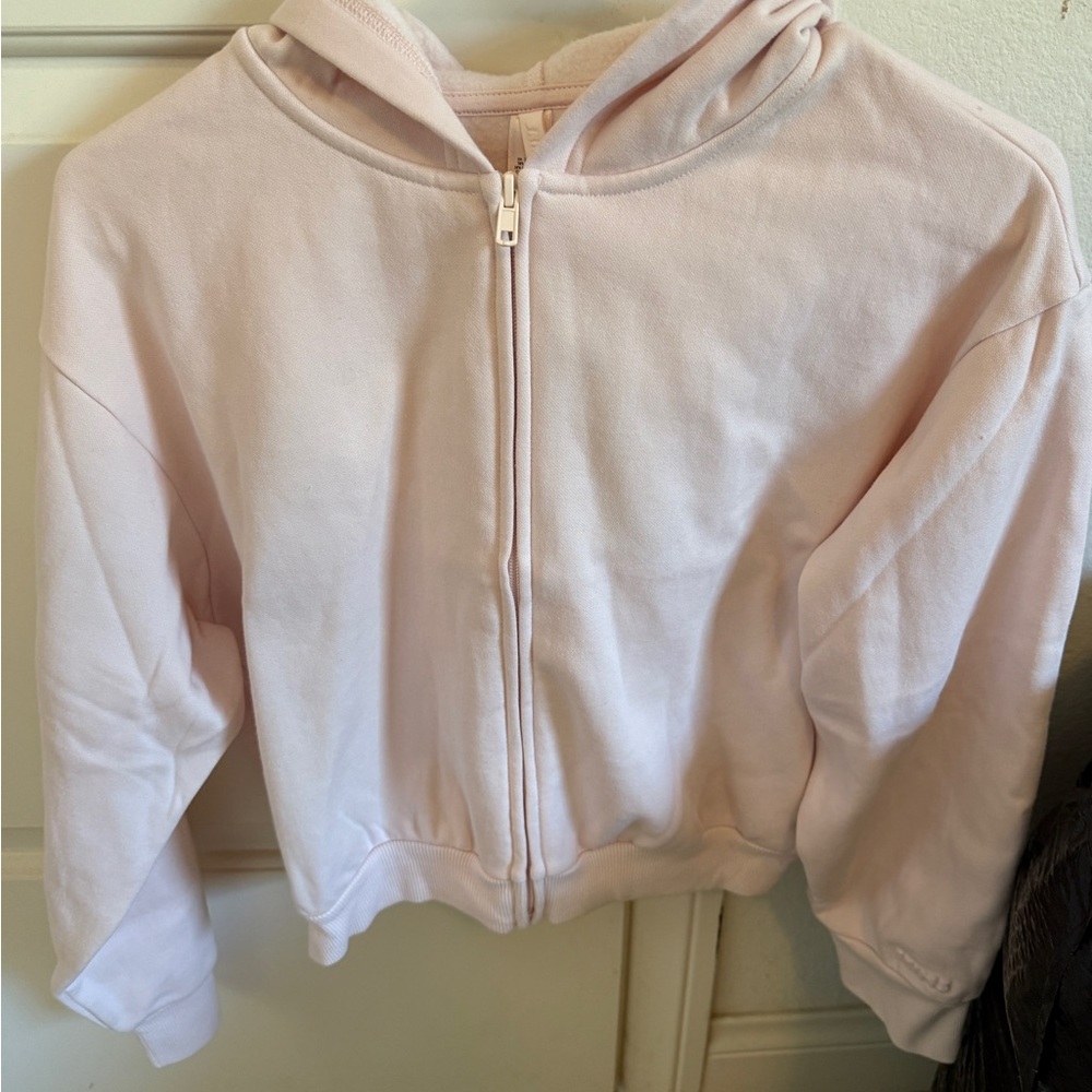 Skims barely pink shrunken zip up hoodie
